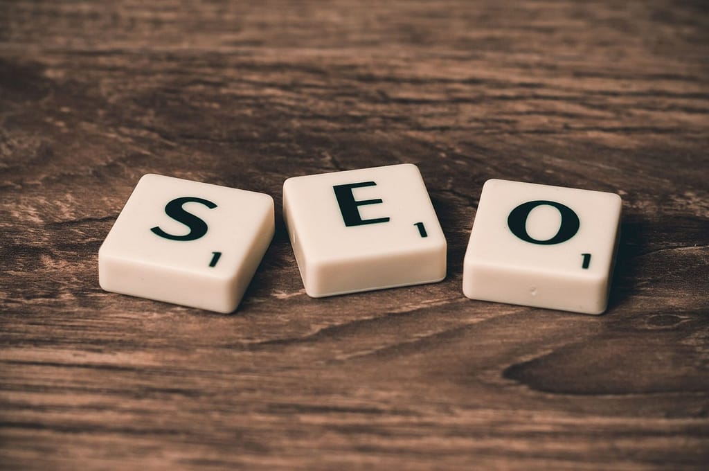 “How to do SEO marketing with SEO letters displayed on wooden blocks, representing search engine optimization.”