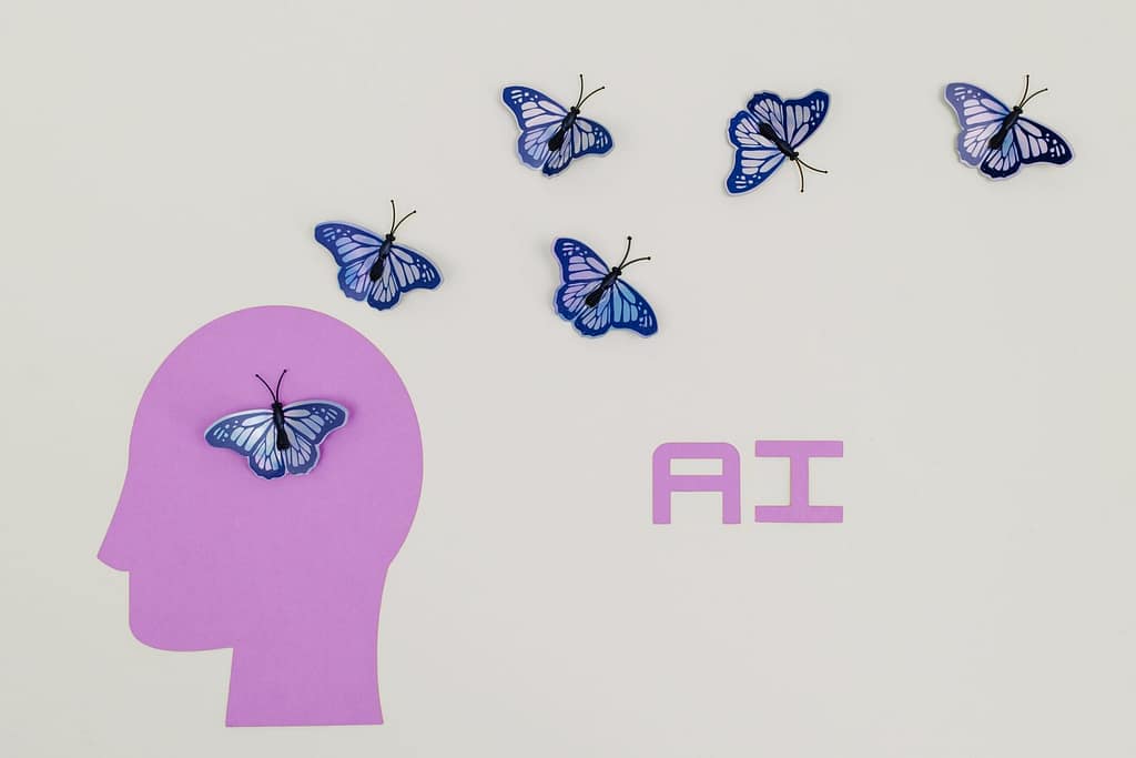 **Alt text (20 words):** Best AI tools for digital marketing represented by a human head silhouette, butterflies, and AI letters symbolizing creativity, intelligence, and innovation.